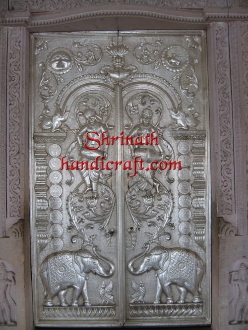 Silver/ Metal Mounted Over Teak Wood Doors Silver/ Metal Mounted Over Teak Wood Doors